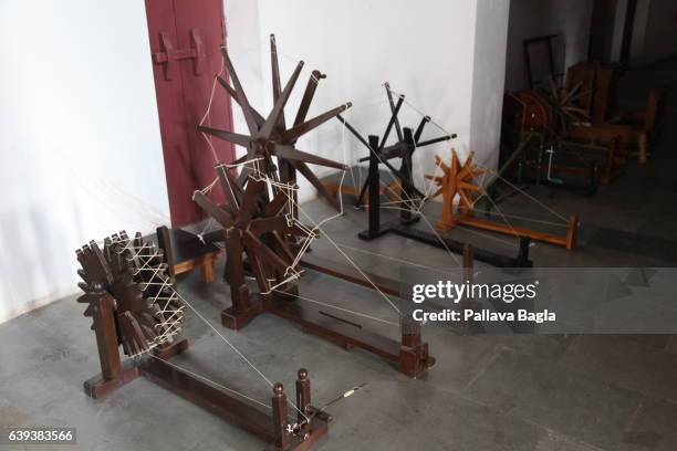 January 10. Various different models of spinning wheels on display in the museum. The unusually sparse home of the Mahatma Gandhi, called the Father...