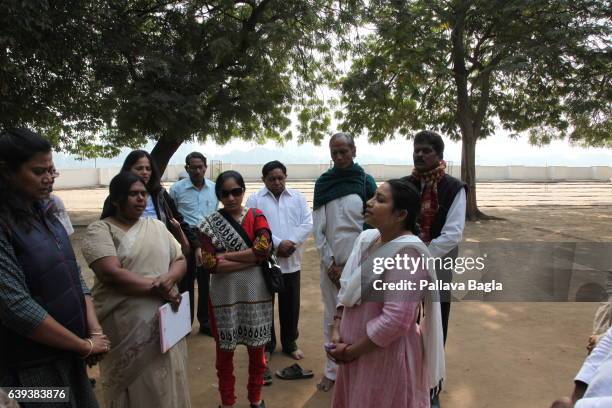 January 10. Vistors sing Mahatma Gandhi's favorite hymn in prayer. The unusually sparse home of the Mahatma Gandhi, called the Father of India....