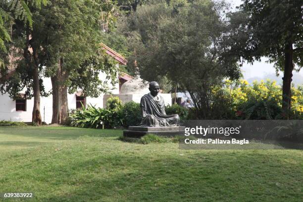 January 10. A statue of Mahatma Gandhi on the lawns of the Ashram. The unusually sparse home of the Mahatma Gandhi, called the Father of India....