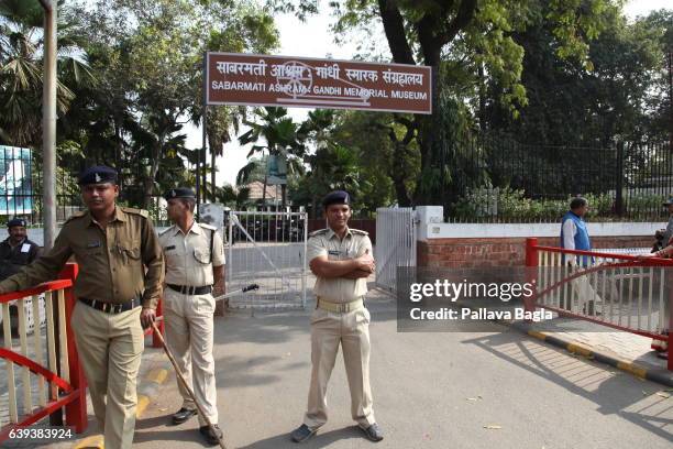 January 10. Police stands on guard at the entrance of the Gandhi Ashram. The unusually sparse home of the Mahatma Gandhi, called the Father of India....