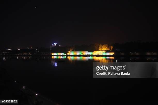 January 10. The Gandhi ashram lit up at night as seen from the far bank of the Sabarmati Ashram it has been decorated in the three favorite colors of...