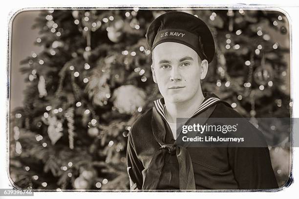 wwii us navy sailor home for the holidays - world war ii america stock pictures, royalty-free photos & images