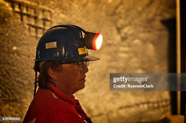 mature woman under ground miner. - mine worker stock pictures, royalty-free photos & images