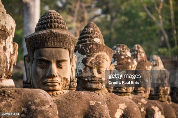 south gate of angkor thom temple in angkor archaeological park, cambodia - angkor thom fotografías e imágenes de stock