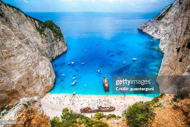 shipwreck in the famous navagio bay, zakynthos island, greece - zakynthos stock pictures, royalty-free photos & images