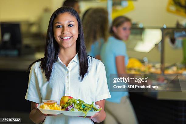 cheerful african american high school student with healthy lunch - lunch tray stock pictures, royalty-free photos & images