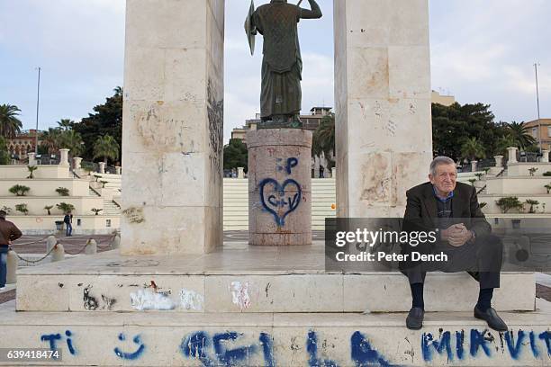 An elderly man looks out across the Messina Strait from the promenade at Reggio Calabria. Founded in 720BC by the ancient Greeks, Reggio di Calabria...