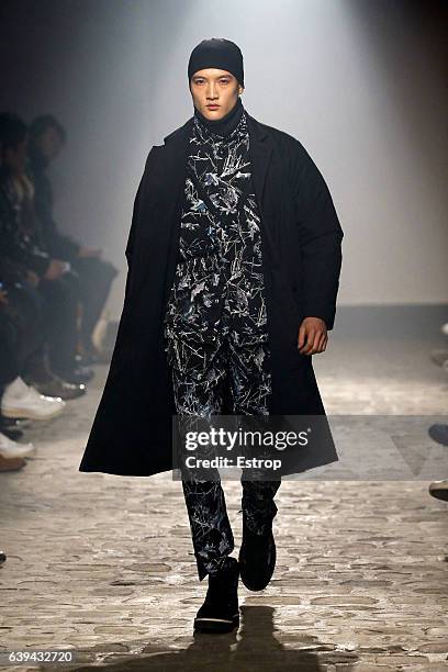 Model walks the runway during the White Mountaineering designed by Yosuke Aizawa Menswear Fall/Winter 2017-2018 show as part of Paris Fashion Week on...