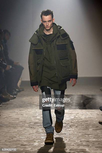 Model walks the runway during the White Mountaineering designed by Yosuke Aizawa Menswear Fall/Winter 2017-2018 show as part of Paris Fashion Week on...