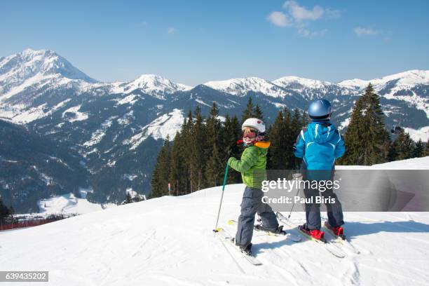 two boys ready for skiing at zauchensee ski-region, austria - family winter sport stock pictures, royalty-free photos & images