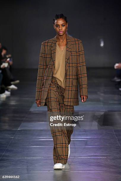 Model walks the runway during the Ami Alexandre Mattiussi Menswear Fall/Winter 2017-2018 show as part of Paris Fashion Week on January 21, 2017 in...