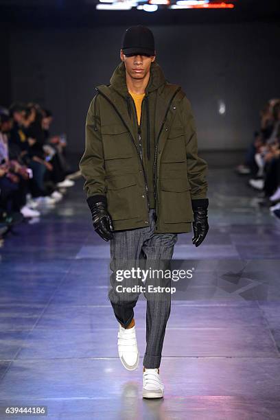 Model walks the runway during the Ami Alexandre Mattiussi Menswear Fall/Winter 2017-2018 show as part of Paris Fashion Week on January 21, 2017 in...