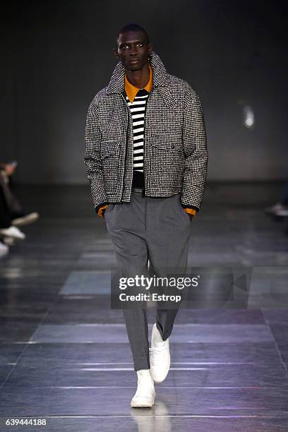 Model walks the runway during the Ami Alexandre Mattiussi Menswear Fall/Winter 2017-2018 show as part of Paris Fashion Week on January 21, 2017 in...