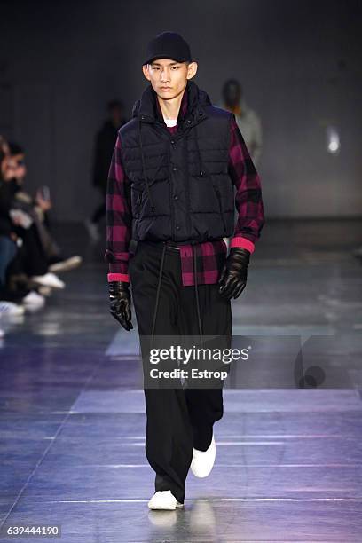 Model walks the runway during the Ami Alexandre Mattiussi Menswear Fall/Winter 2017-2018 show as part of Paris Fashion Week on January 21, 2017 in...