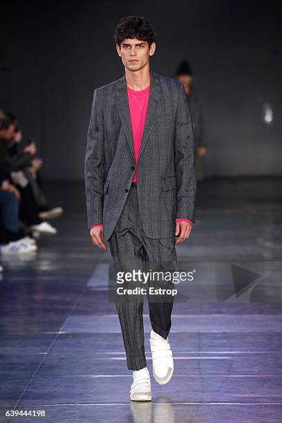 Model walks the runway during the Ami Alexandre Mattiussi Menswear Fall/Winter 2017-2018 show as part of Paris Fashion Week on January 21, 2017 in...