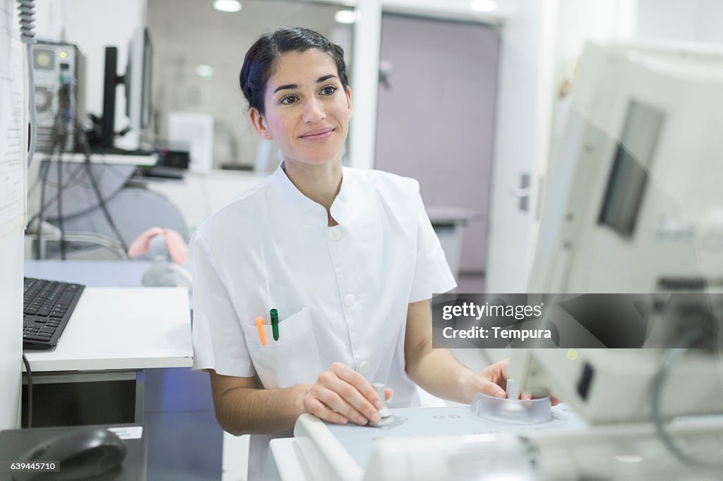 X-ray technician and equipment in a hospital