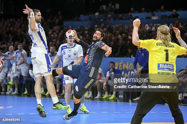 Nikola Karabatic of France is shooting the ball against Bjorgvin Pall Gustavsson of Iceland during the 25th IHF Men's World Championship 2017 Round...