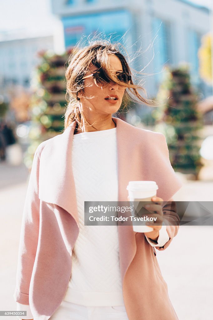 Beautiful elegant woman drinking coffee