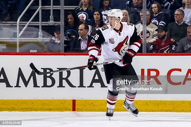 Michael Stone of the Arizona Coyotes follows the play up the ice during first period action against the Winnipeg Jets at the MTS Centre on January...