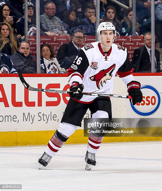 Michael Stone of the Arizona Coyotes keeps an eye on the play during first period action against the Winnipeg Jets at the MTS Centre on January 18,...