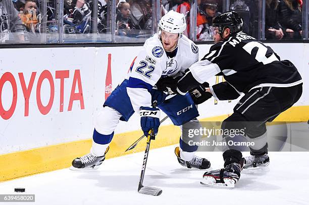 Erik Condra of the Tampa Bay Lightning battles for the puck against Alec Martinez of the Los Angeles Kings during the game on January 16, 2017 at...