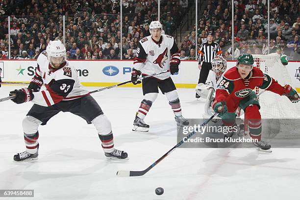 Alex Goligoski, Michael Stone, and Mike Smith of the Arizona Coyotes defend against Mikael Granlund of the Minnesota Wild during the game on January...