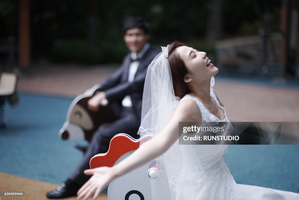 Bride and groom in amusement parks