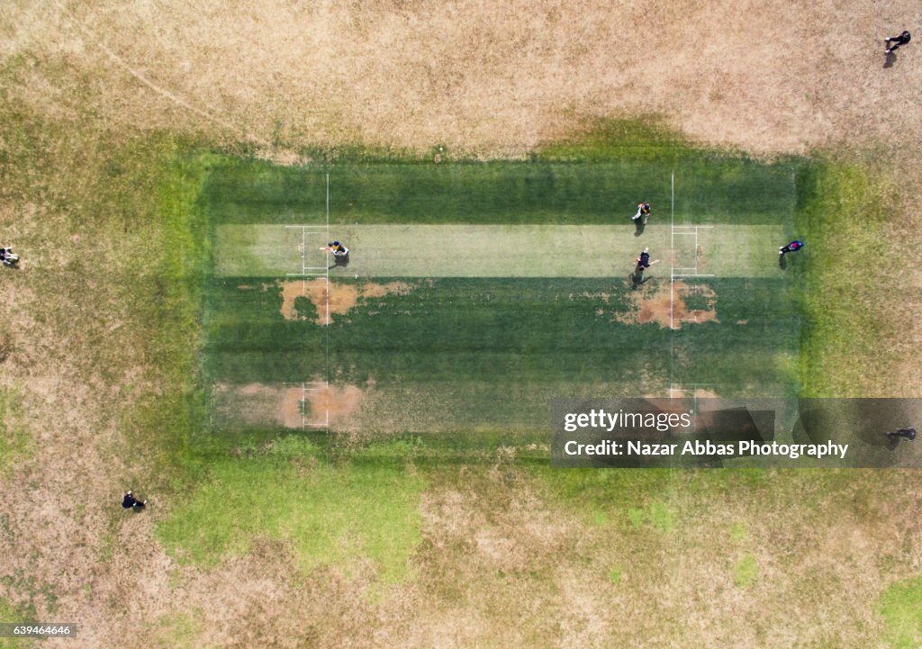 Aerial view of People Playing Cricket In Ground.