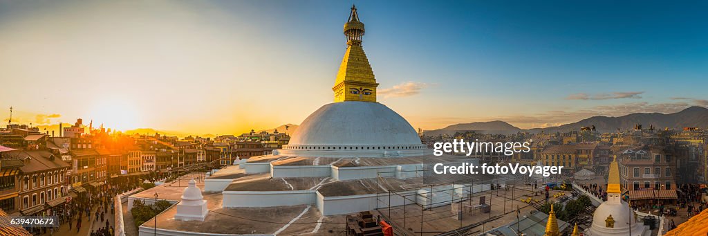Boudhanath iconic Buddhist stupa and pilgrims at sunset Kathmandu Nepal