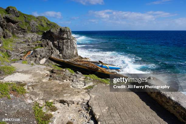 canoes by the sea - niue island stockfoto's en -beelden