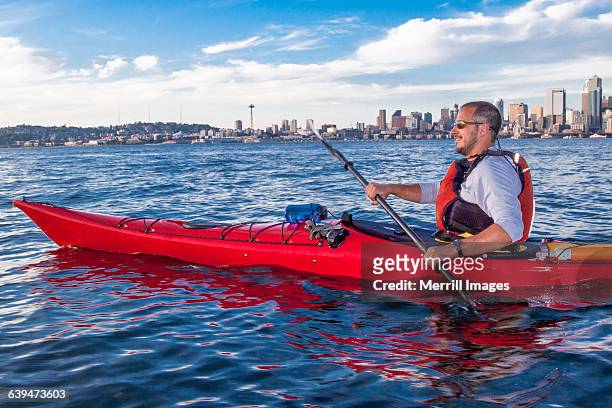 kayaking in seattle, wa. - seattle city life stock pictures, royalty-free photos & images