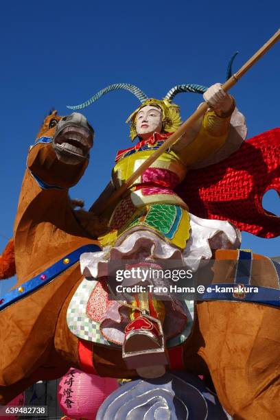 a fighting woman, "fa mulan" on a horse statue in nagasaki lantern festival - lantaarnfestival van nagasaki stockfoto's en -beelden