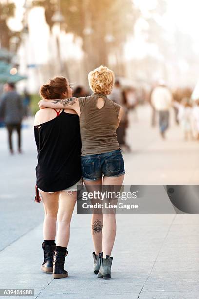 women couple walking - lise gagne stock pictures, royalty-free photos & images