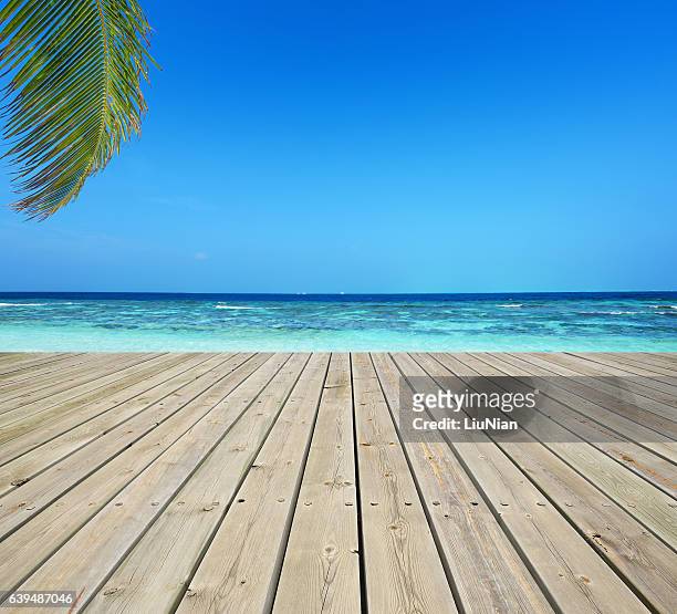 wooden terrace and tropical seascape - boardwalk stockfoto's en -beelden