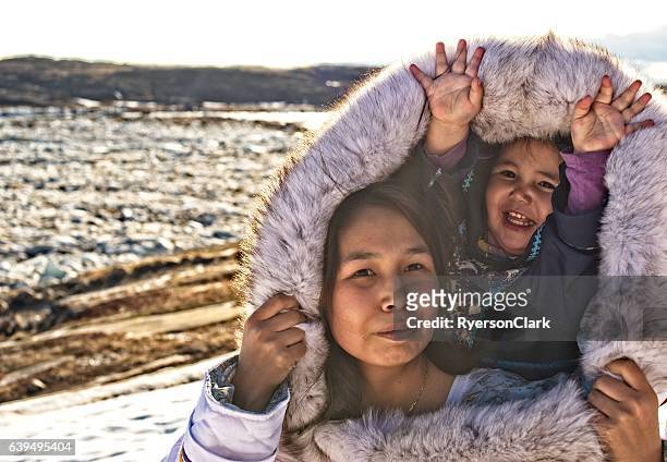 inuit mother and daughter on baffin island, nunavut, canada. - inuit stock pictures, royalty-free photos & images