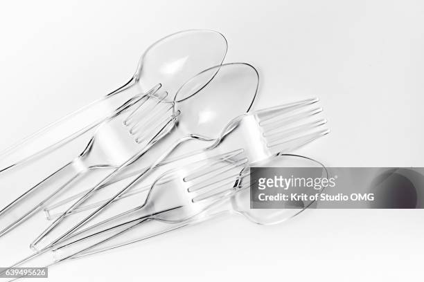 group of transparent plastic cutlery - plastic cutlery stock pictures, royalty-free photos & images