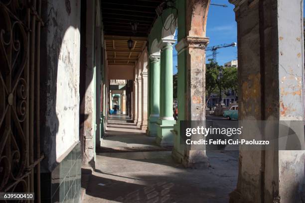 arcade of a building in centro havana of cuba - havana door stock pictures, royalty-free photos & images