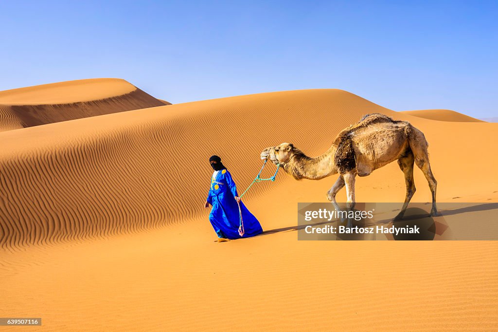 Young Tuareg with camel on Western Sahara Desert in Africa