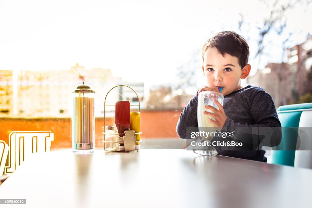 Portrait of a boy having a milkshake