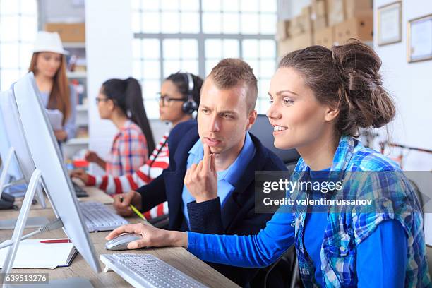 young businessman explaining to new trainee - trainee program stock pictures, royalty-free photos & images