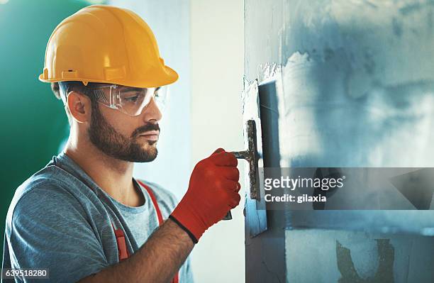 construction worker. - plasterboard stock pictures, royalty-free photos & images