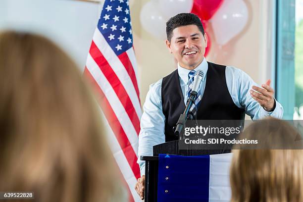 confident hispanic politician addresses supporters during rally - mayor meeting stock pictures, royalty-free photos & images