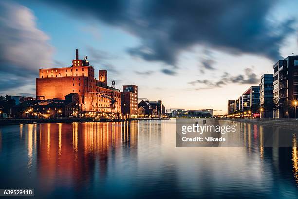 view of duisburg inner harbour at dusk - north rhine westphalia stock pictures, royalty-free photos & images