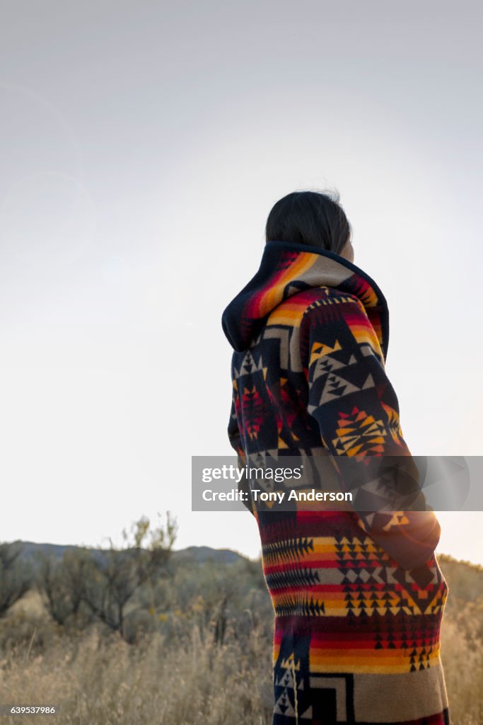 Young woman outdoors at sunset