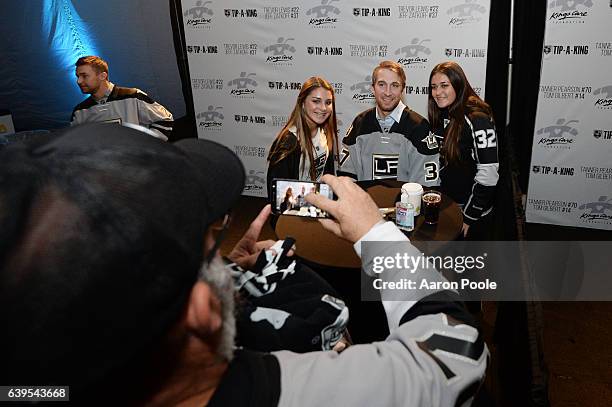 Jeff Zatkoff of the Los Angeles Kings poses for a photo with fans during Tip-A-King 2017 at the L.A. LIVE Event Deck on January 07, 2017 in Los...