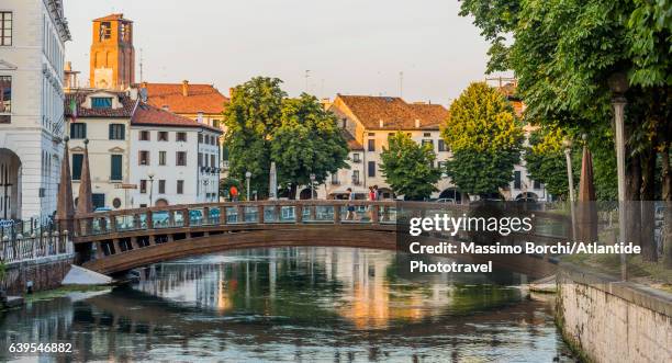 university quarter, the river sile and the ponte delle università, a pedestrian bridge on the river - treviso italy stock pictures, royalty-free photos & images