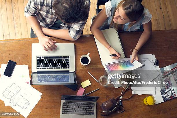 college students collaborating on project - designer coffee table stock pictures, royalty-free photos & images