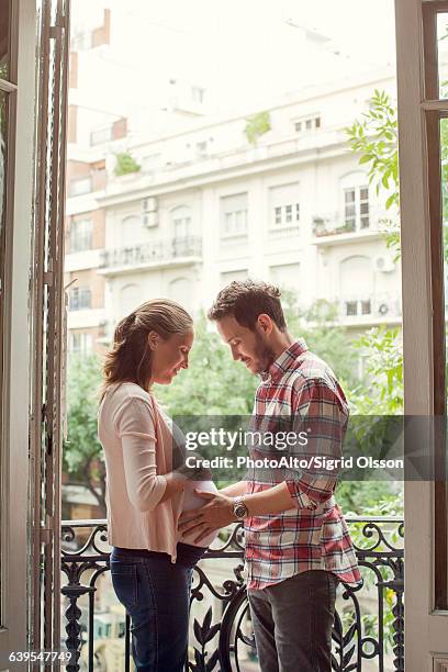 expecting couple - french doors stock pictures, royalty-free photos & images