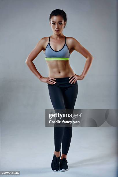 fitness woman standing - china athlete woman stock-fotos und bilder