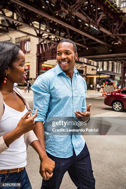 lovely couple having great time together in chicago - chicago lifestyle stock pictures, royalty-free photos & images